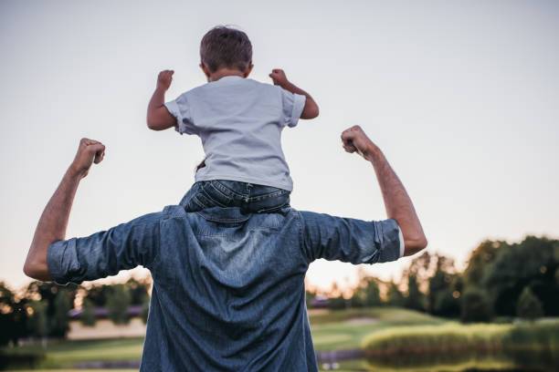 Dad and son having fun outdoors. Dad and son having fun outdoors.